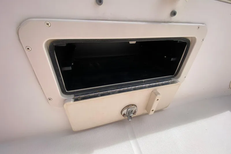 Slide: The Image of Storage compartment on a 2005 Grady-White Advance 257 boat. - 94