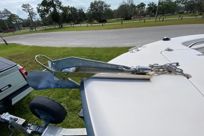 Slide: The Image of 2005 Grady-White Advance 257 boat anchor and chain on trailer, parked in grassy area. - 96