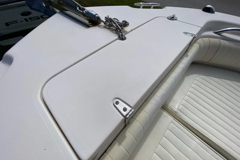 Slide: The Image of 2005 Grady-White Advance 257 boat deck with anchor and cushioned seating. - 97