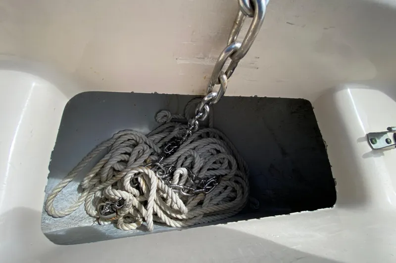 Slide: The Image of Anchor chain and rope in a 2005 Grady-White Advance 257 boat compartment. - 99