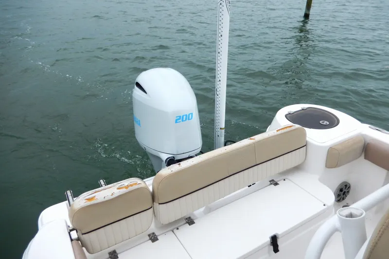 Slide: The Image of Open storage compartment on 2018 Sea Fox 226 Commander boat with beige seating. - 12