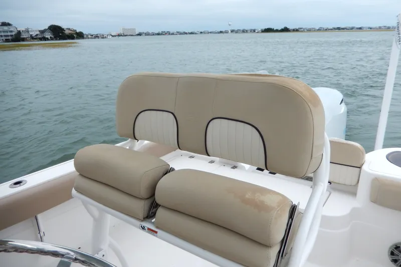 Slide: The Image of 2018 Sea Fox 226 Commander storage compartment with safety equipment and seating. - 15
