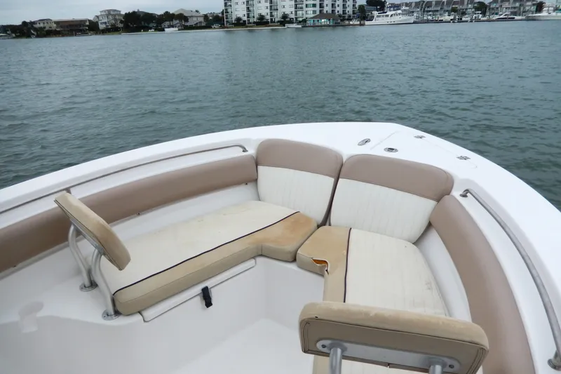Slide: The Image of 2018 Sea Fox 226 Commander boat with spacious seating area on calm water. - 9
