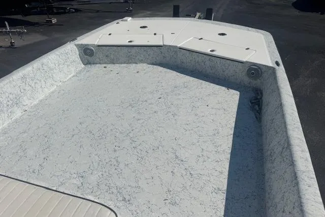 Slide: The Image of 2016 Dargel Kat 250 HDX boat deck with storage compartments, textured surface, and speakers. - 14