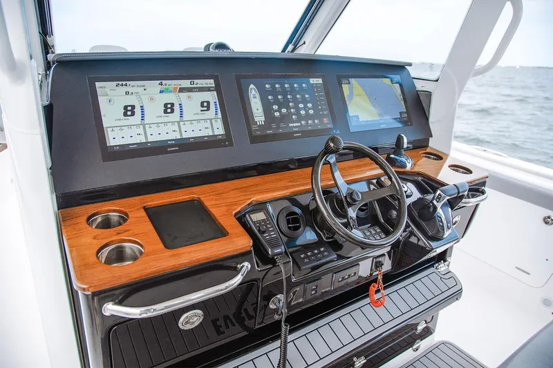 Slide: The Image of Manufacturer Provided Image: 2025 Everglades 395 Center Console boat dashboard with advanced navigation displays. - 4
