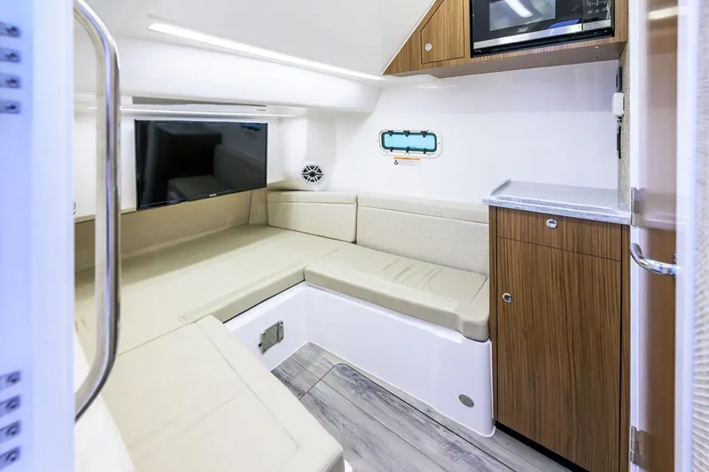 Slide: The Image of Manufacturer Provided Image: Luxurious interior of 2025 Everglades 395 Center Console boat with seating and cabinetry. - 7