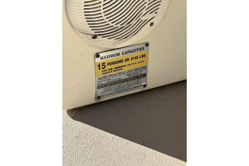 Slide: The Image of 1997 Harris 240 capacity plate, maximum 15 persons or 2145 lbs, beige background. - 14