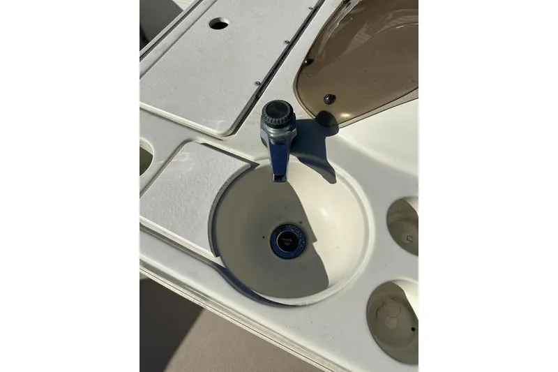 Slide: The Image of Boat sink and faucet on a 1997 Harris 240 model. - 17