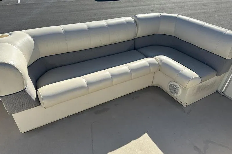 Slide: The Image of Gray L-shaped boat seating on a Harris 240, 1997 model. - 9