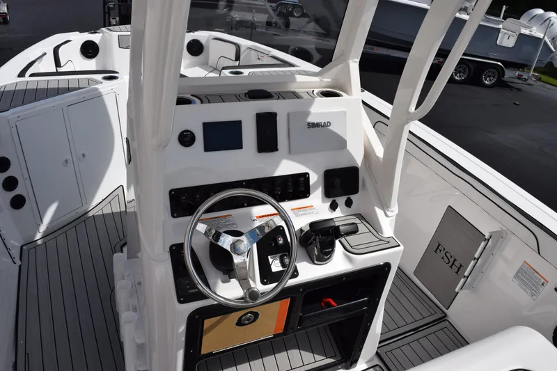 Slide: The Image of 2026 Yamaha Boats 222 FSH Sport E dashboard with steering wheel and controls. - 11