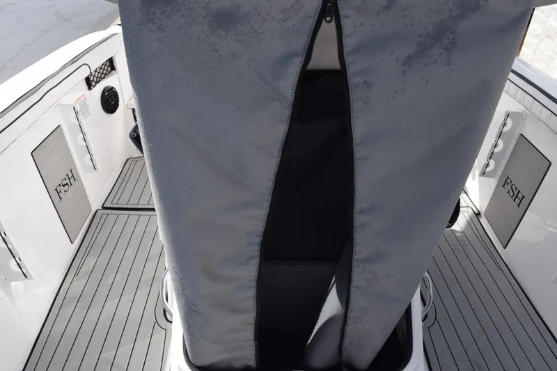 Slide: The Image of 2026 Yamaha Boats 222 FSH Sport E interior with gray flooring and FSH branding. - 20