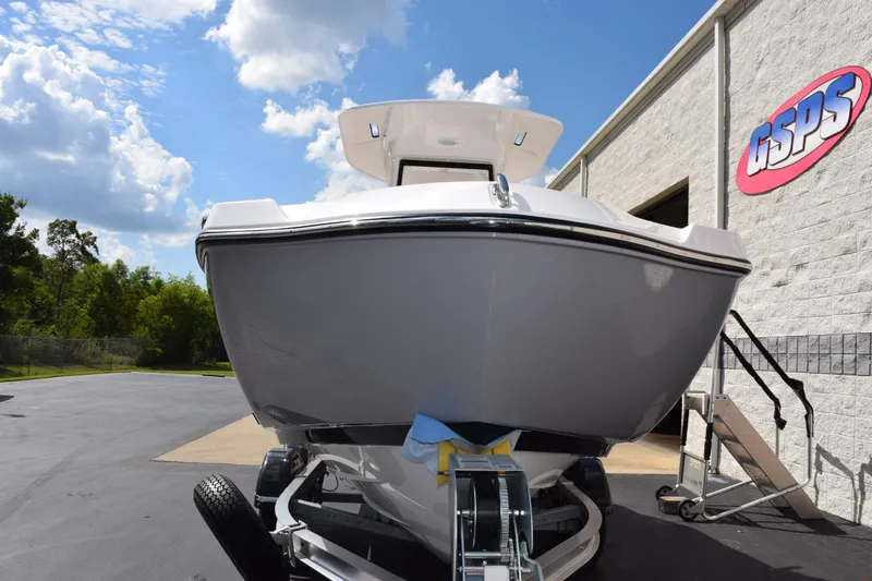 Slide: The Image of 2026 Yamaha Boats 222 FSH Sport E on trailer, outside dealership under blue sky. - 3