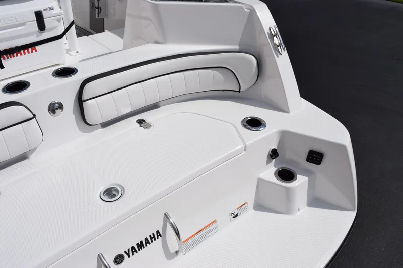 Slide: The Image of 2026 Yamaha Boats 222 FSH Sport E, white seating and deck, sleek design. - 7