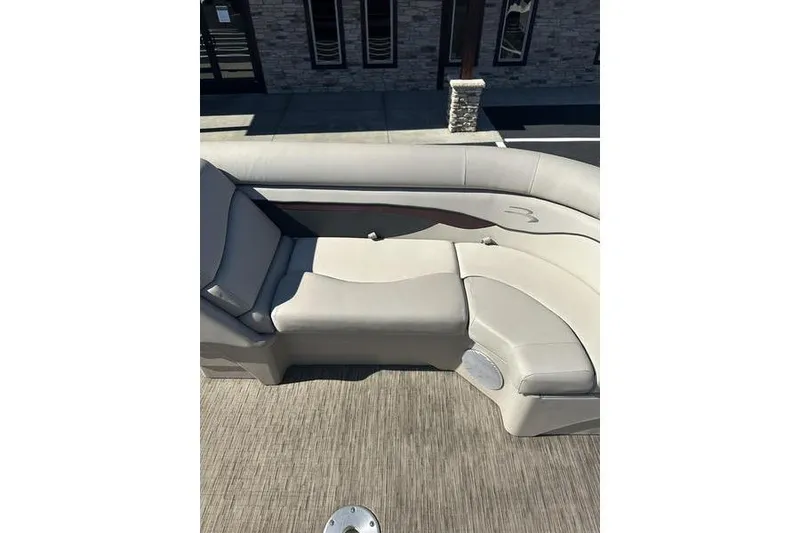 Slide: The Image of 2019 Bennington 22 SSRCX boat interior with beige seating and flooring. - 10