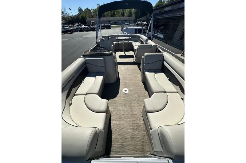 Slide: The Image of 2019 Bennington 22 SSRCX pontoon boat with spacious seating and canopy. - 7