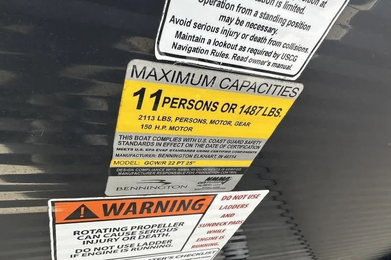 Slide: The Image of 2016 Bennington 2250 GSR capacity label, 11 persons or 1487 lbs, safety warnings. - 12