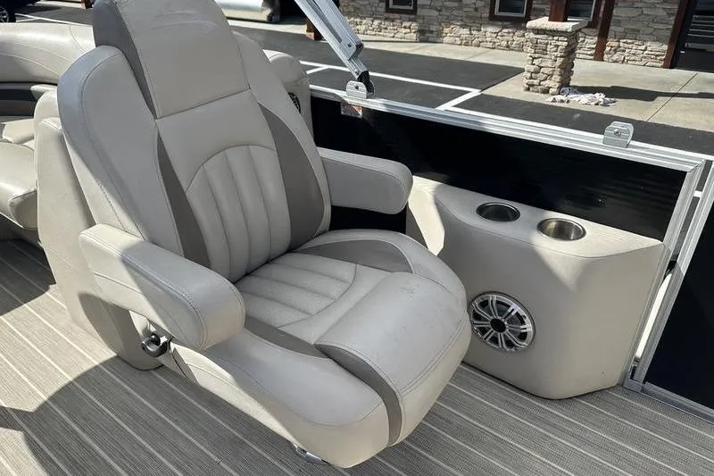 Slide: The Image of Luxurious seating on 2016 Bennington 2250 GSR boat with cup holders and speaker. - 13