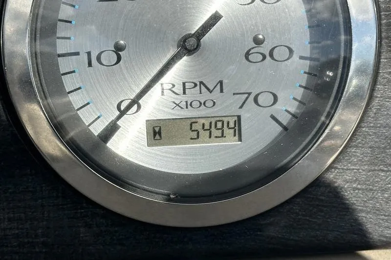 Slide: The Image of Close-up of a 2016 Bennington 2250 GSR tachometer showing 5494 RPM. - 19
