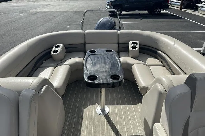Slide: The Image of 2016 Bennington 2250 GSR pontoon boat interior with seating and table. - 20