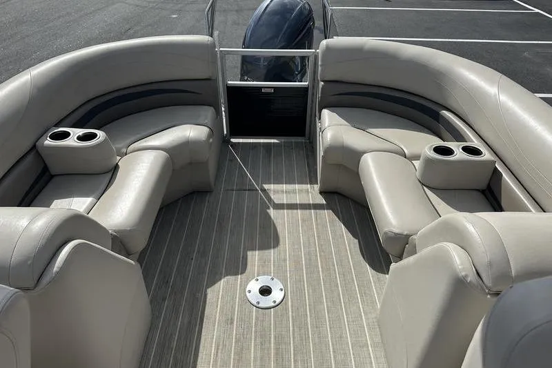 Slide: The Image of 2016 Bennington 2250 GSR pontoon boat interior with plush seating and cup holders. - 22