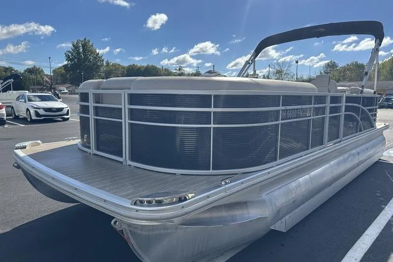 Slide: The Image of 2016 Bennington 2250 GSR pontoon boat parked under a clear blue sky. - 5