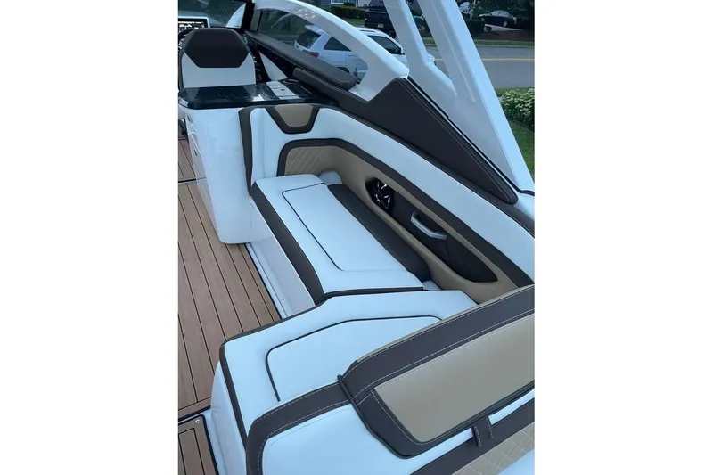 Slide: The Image of 2021 Yamaha Boats 275SD interior with sleek seating and modern design. - 11