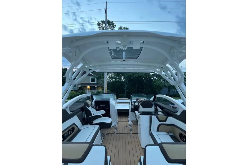 Slide: The Image of 2021 Yamaha Boats 275SD interior with sleek seating and modern design. - 12