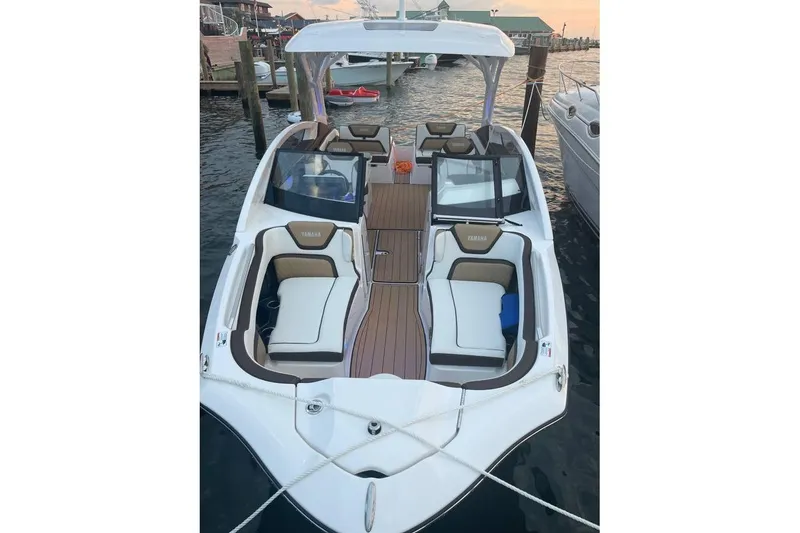 Slide: The Image of 2021 Yamaha Boats 275SD docked, featuring spacious seating and sleek design. - 3