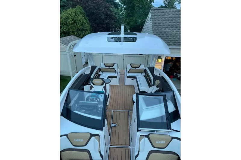 Slide: The Image of 2021 Yamaha Boats 275SD interior with sleek seating and modern design. - 4