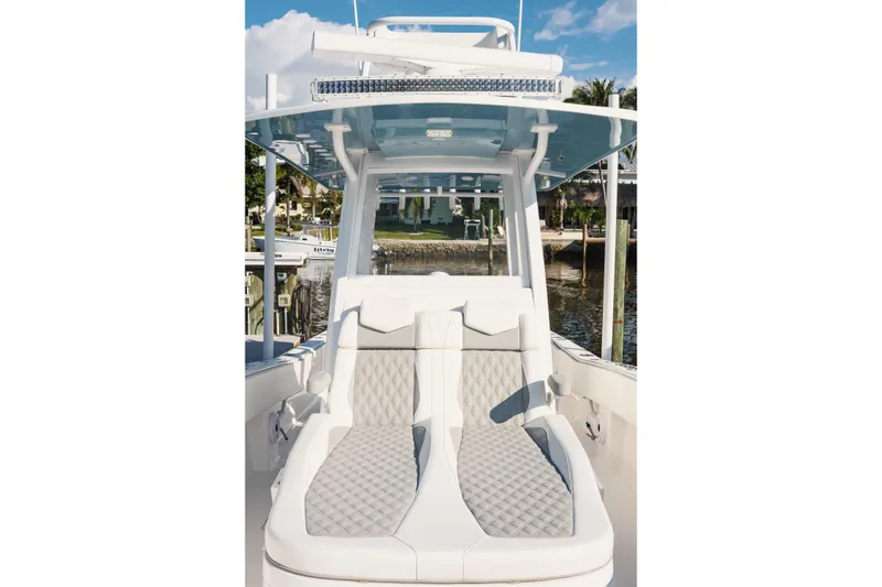 Slide: The Image of 2023 Invincible 36 Open Fisherman boat dashboard with ocean view. - 11