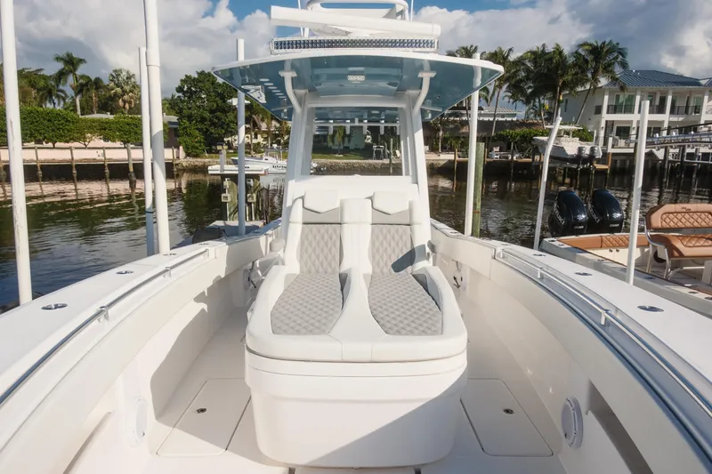 Slide: The Image of 2023 Invincible 36 Open Fisherman boat on ocean with triple Mercury engines. - 13