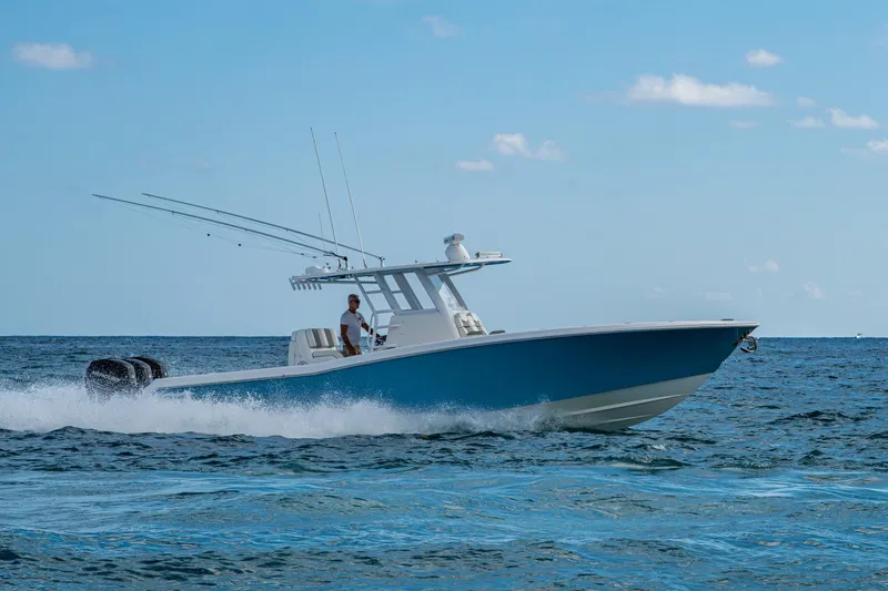 Slide: The Image of 2023 Invincible 36 Open Fisherman boat cruising on the ocean under a clear blue sky. - 18