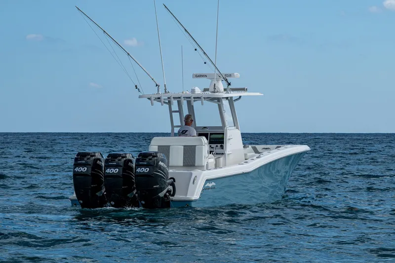 Slide: The Image of 2023 Invincible 36 Open Fisherman boat with triple 400 engines on open sea. - 21