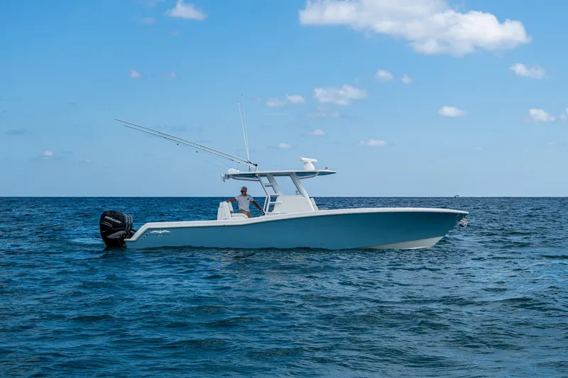 Slide: The Image of 2023 Invincible 36 Open Fisherman boat on open sea under blue sky. - 22