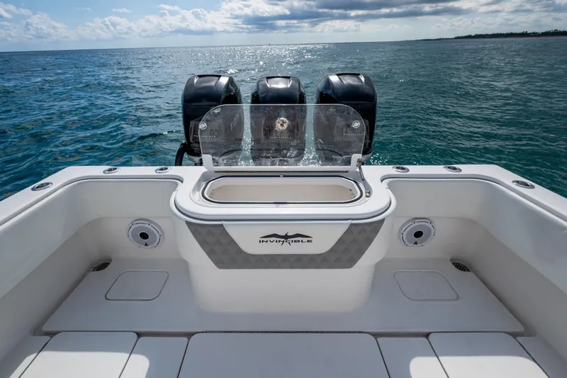 Slide: The Image of 2023 Invincible 36 Open Fisherman boat with triple engines on open sea. - 23