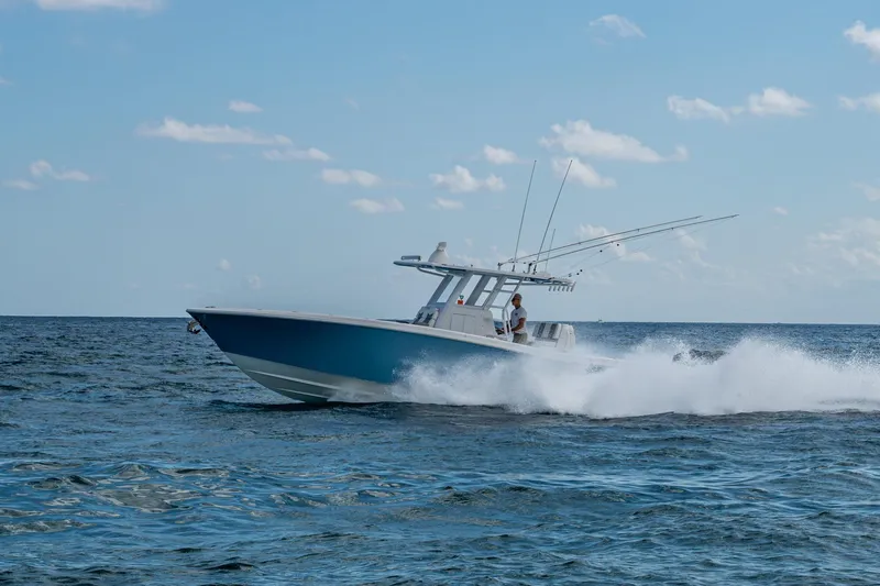 Slide: The Image of 2023 Invincible 36 Open Fisherman boat cruising on open ocean waters. - 25