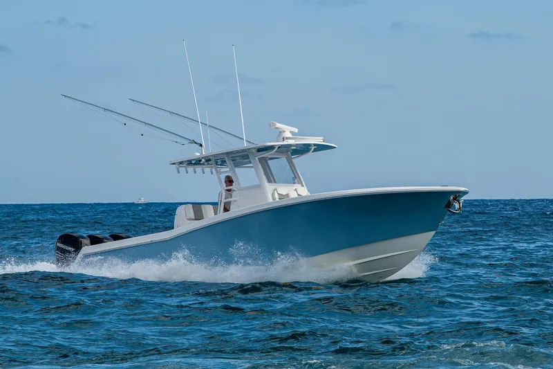 Slide: The Image of 2023 Invincible 36 Open Fisherman boat cruising on open ocean waters. - 27