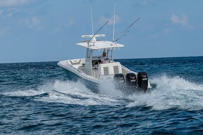 Slide: The Image of 2023 Invincible 36 Open Fisherman boat cruising on ocean waves. - 28