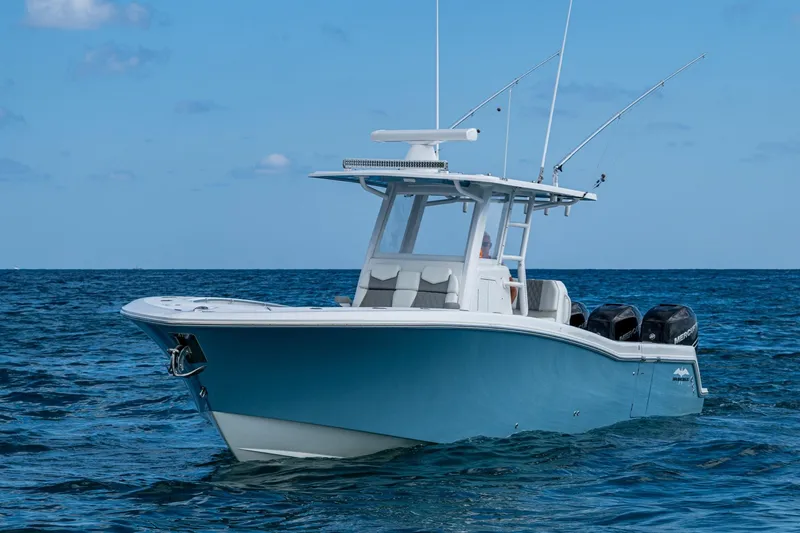 Slide: The Image of 2023 Invincible 36 Open Fisherman boat on open sea, featuring sleek design and powerful engines. - 29