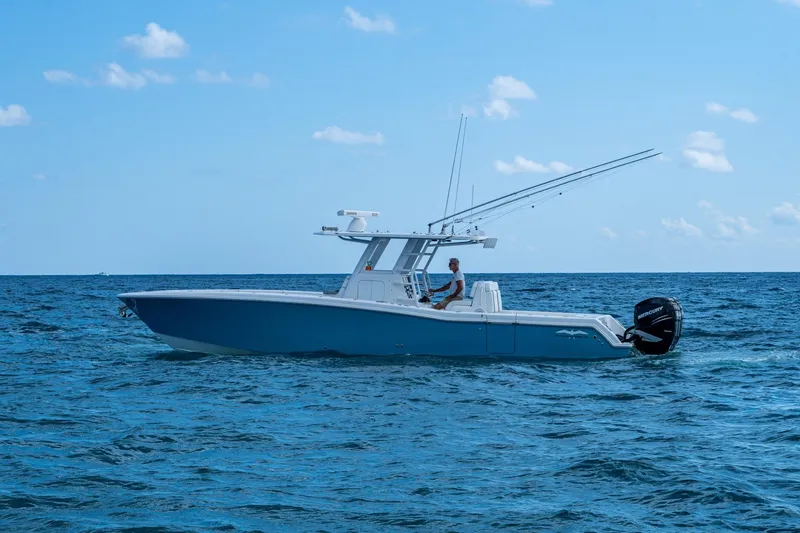 Slide: The Image of 2023 Invincible 36 Open Fisherman boat cruising on open ocean waters. - 31