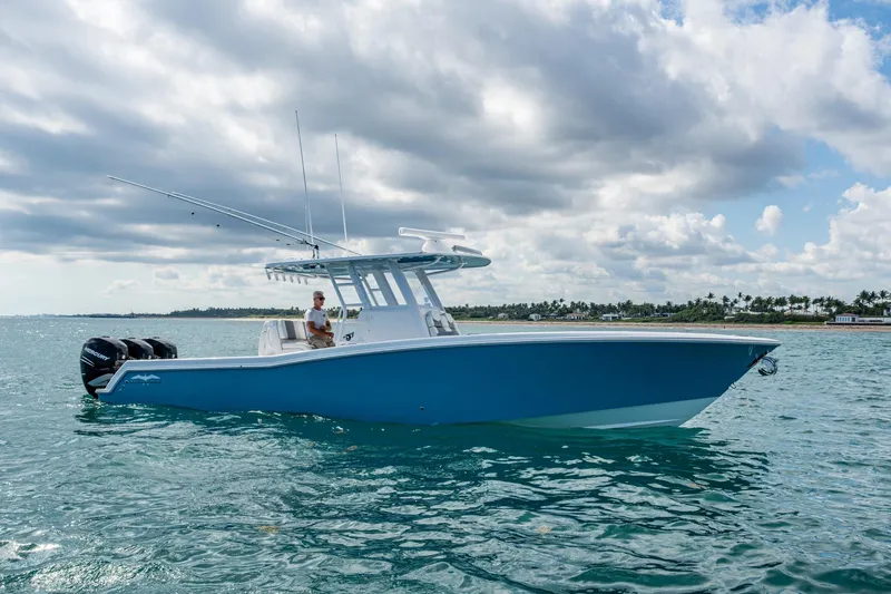 Slide: The Image of 2023 Invincible 36 Open Fisherman boat on calm ocean waters under cloudy sky. - 32