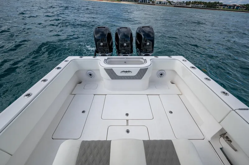 Slide: The Image of 2023 Invincible 36 Open Fisherman boat with triple outboard engines on the ocean. - 34