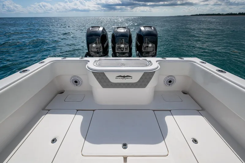 Slide: The Image of 2023 Invincible 36 Open Fisherman boat with triple engines on open sea. - 35