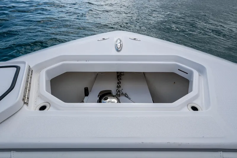 Slide: The Image of Bow storage compartment on 2023 Invincible 36 Open Fisherman boat, with anchor chain visible. - 40
