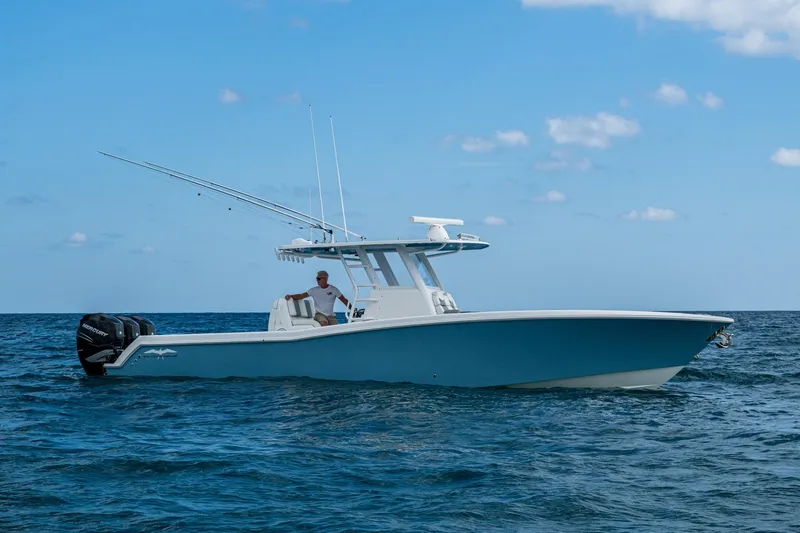 Slide: The Image of 2023 Invincible 36 Open Fisherman boat on open water under clear blue sky. - 43