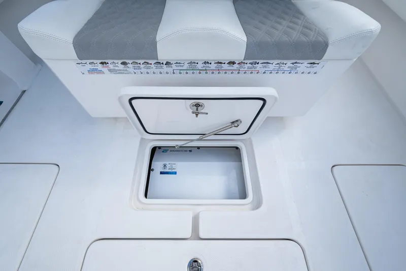 Slide: The Image of 2023 Invincible 36 Open Fisherman boat storage compartment with cushioned seating. - 47