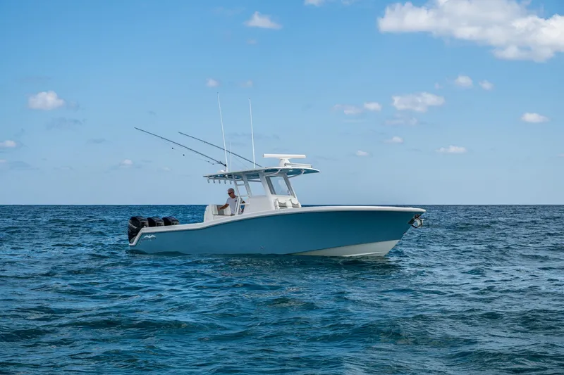 Slide: The Image of 2023 Invincible 36 Open Fisherman boat on open sea under blue sky. - 50