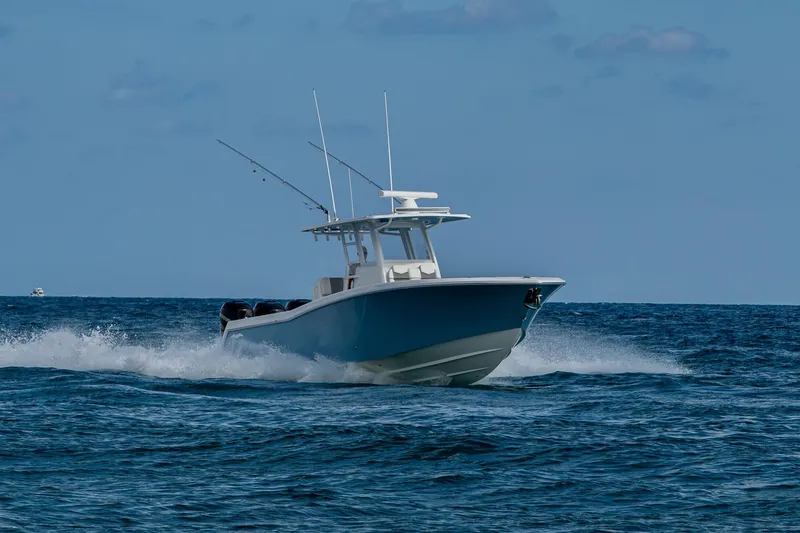 Slide: The Image of 2023 Invincible 36 Open Fisherman boat cruising on open ocean waters. - 51