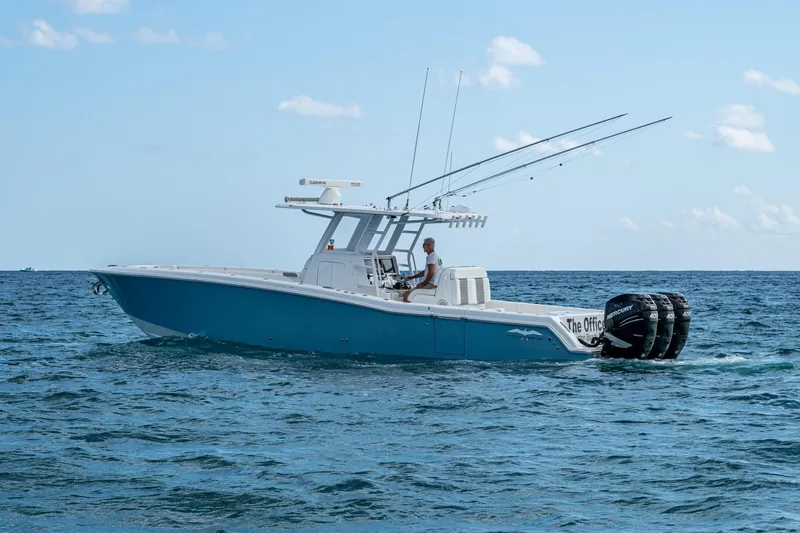 Slide: The Image of 2023 Invincible 36 Open Fisherman boat cruising on the ocean with multiple outboard engines. - 58