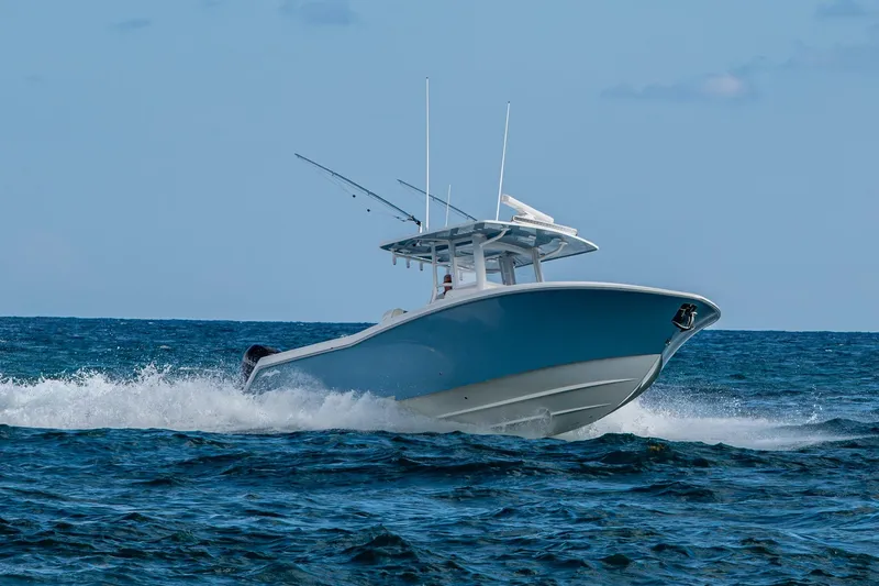 Slide: The Image of 2023 Invincible 36 Open Fisherman boat cruising on open ocean waters. - 62